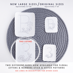 Two sizes of floral number and letter stick and stitch embroidery patterns on a gray mat.