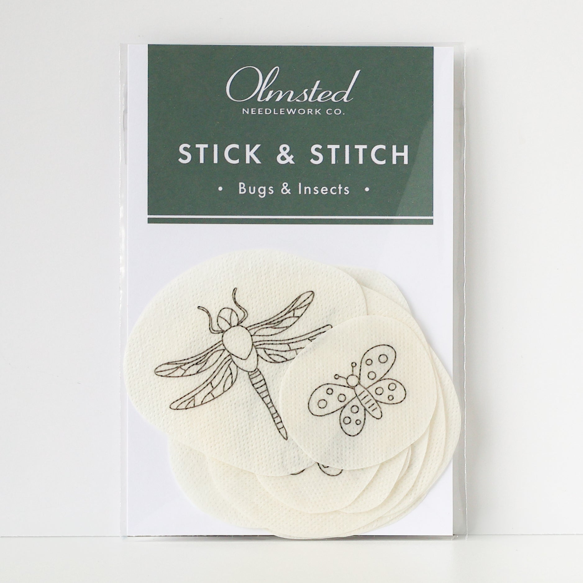 Pack of 14 white water-soluble stick and stitch embroidery patterns featuring various bug and insect designs like a dragonfly and butterfly.