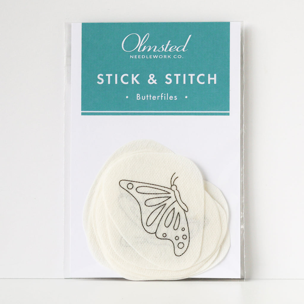 Pack of Olmsted Needlework Co. Stick & Stitch butterfly embroidery patterns on water-soluble paper.