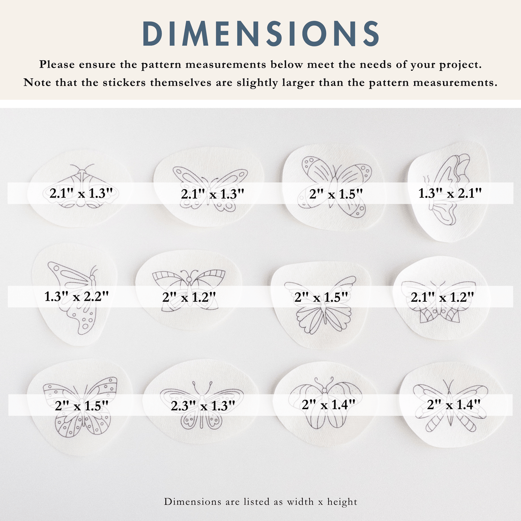 Twelve white water-soluble butterfly embroidery patterns with various dimensions, from 1.3" to 2.3" wide.