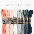DMC embroidery floss bundle, "Foggy Orchard," with 8 skeins in peach, cream, white, sage, blue-gray, and dark blue.