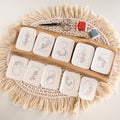 Floral numbers 0-9 stick and stitch embroidery patterns on a wood tray with scissors and thread.