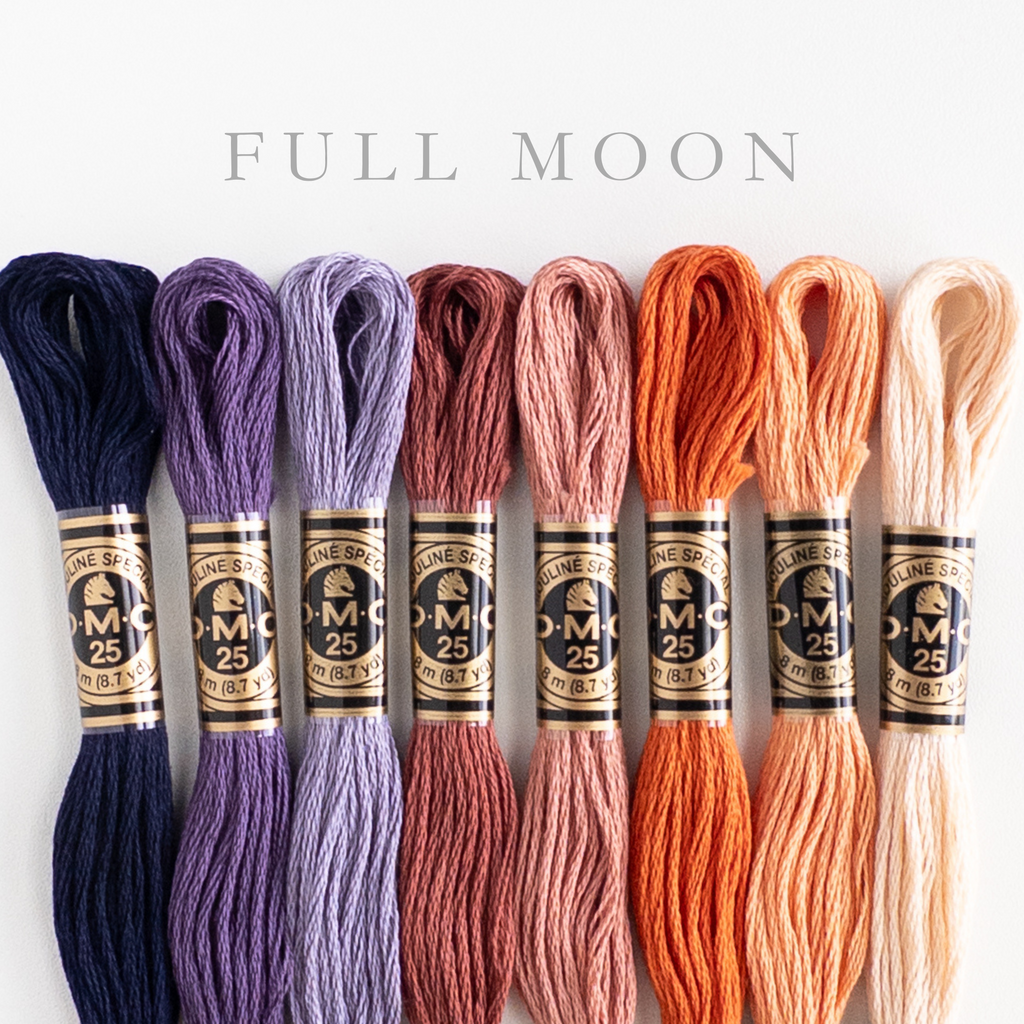 DMC "Full Moon" embroidery floss bundle with 8 skeins in shades of navy, purple, peach, and orange.