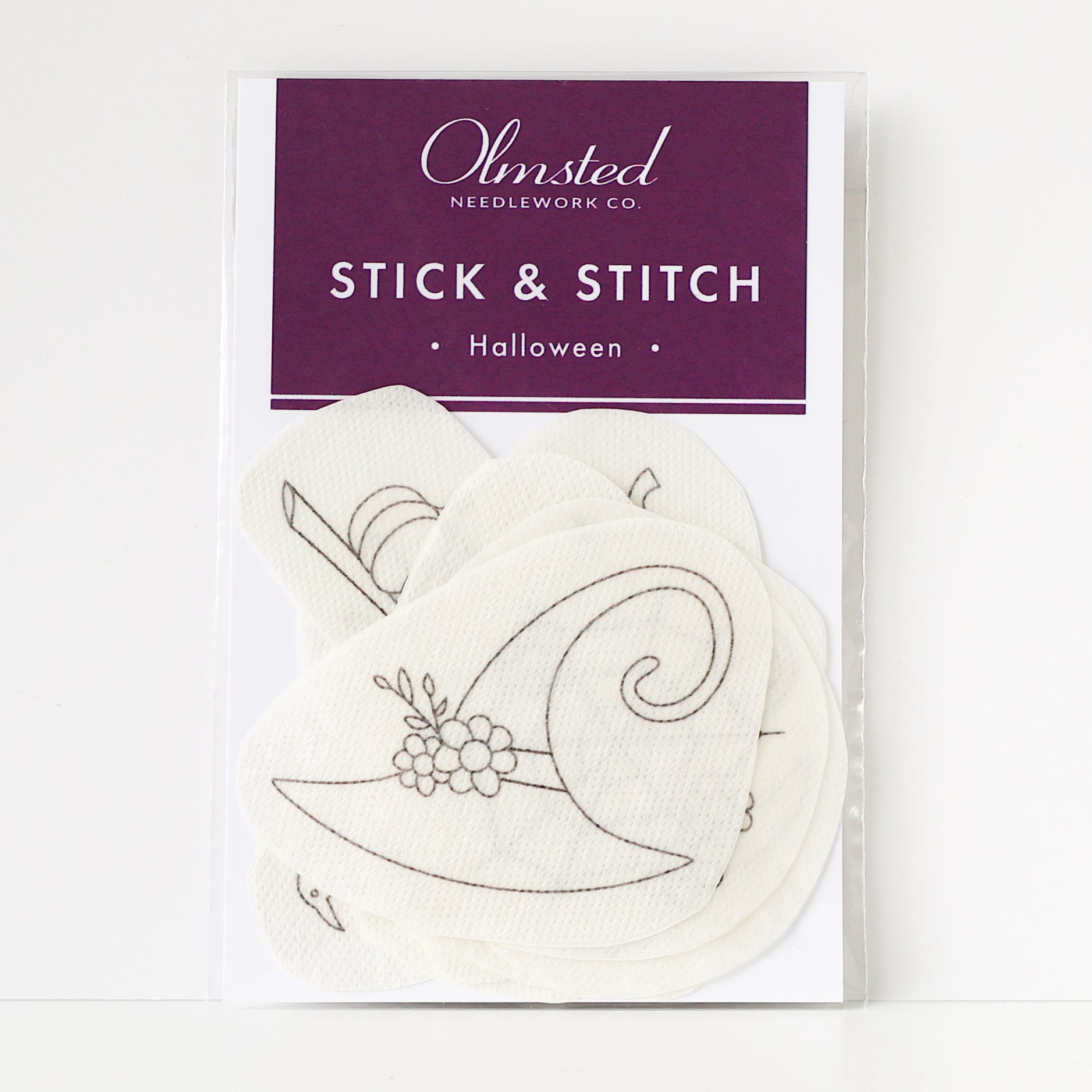 Pack of Olmsted Needlework Co. Halloween Stick & Stitch embroidery patterns, featuring a witch hat design.
