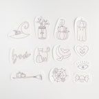 12 Halloween stick and stitch embroidery patterns: witch hat, cat, pumpkins, ghost, spiderweb, broom, and more.