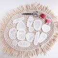 13 heart-themed stick and stitch embroidery patterns on a fringed mat with pink floss and scissors.