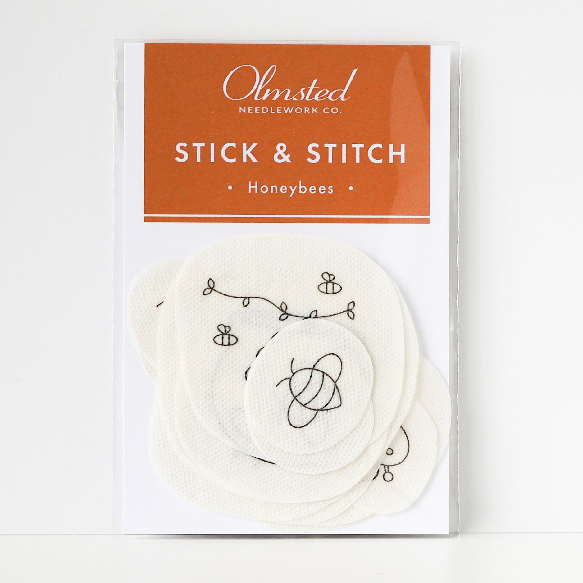 Pack of Olmsted Needlework Co. Honeybee Stick & Stitch embroidery patterns on white water-soluble stabilizer.