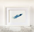 Framed Lake Erie cross-stitch art in shades of blue, showing bathymetric depths.