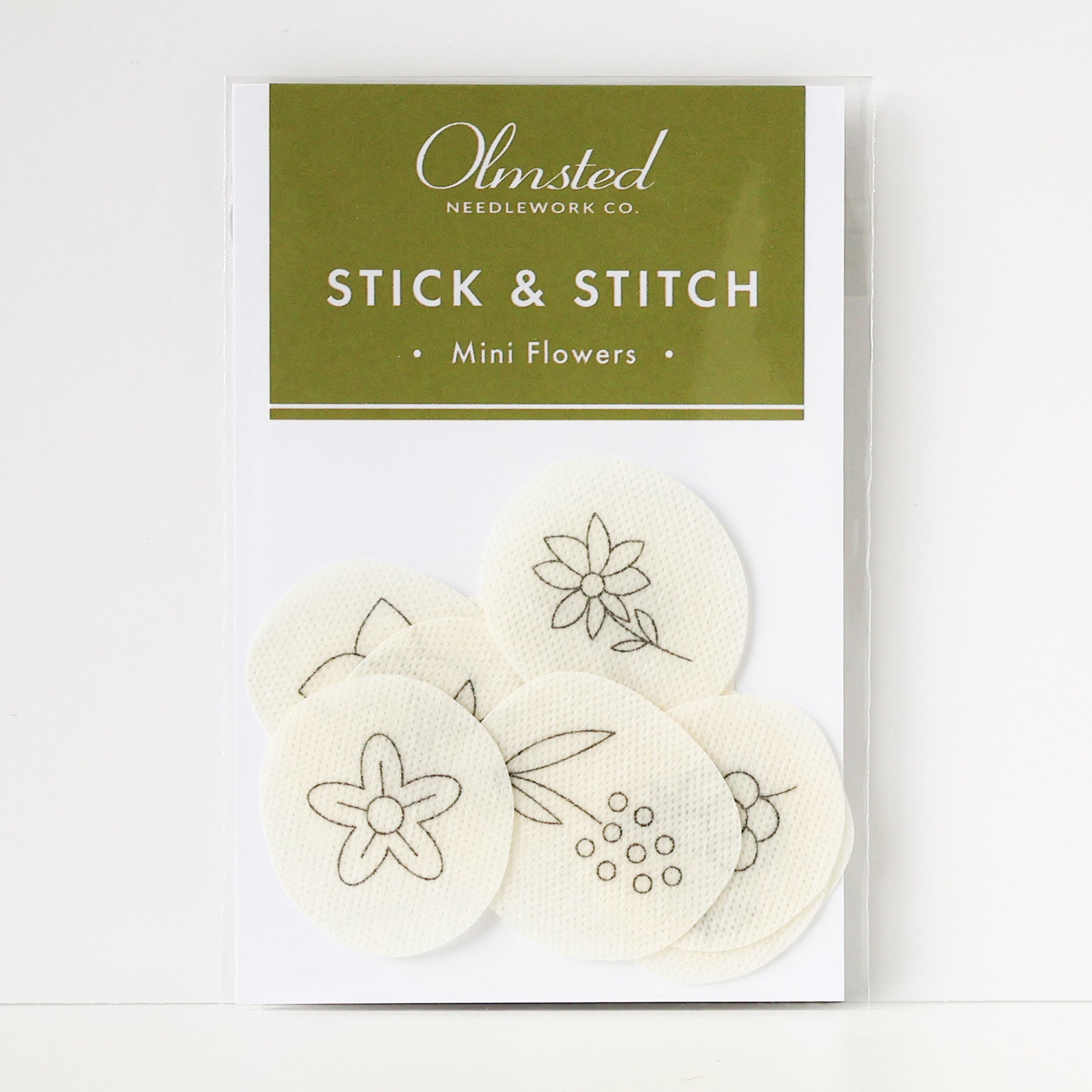 Olmsted Needlework Co. Stick & Stitch Mini Flowers: 12 small, round, water-soluble embroidery patterns.
