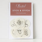 Olmsted Needlework Co. Stick & Stitch mini mushroom embroidery patterns on white water-soluble stabilizer patches.
