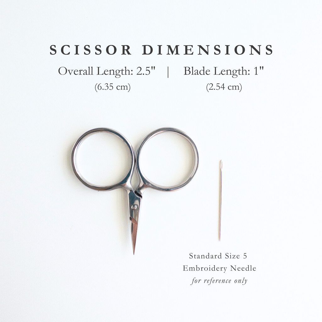 Pair of silver embroidery scissors with dimensions displayed on a white background with an embroidery needle for size comparison. Scissor dimensions are: Overall length 2.5", Blade Length: 1". 