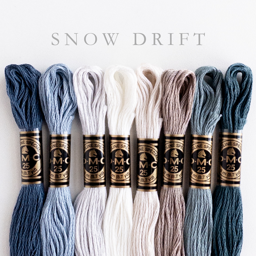 DMC Snow Drift embroidery floss bundle with 8 skeins in shades of blue, gray, and white.