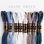 DMC Snow Drift embroidery floss bundle with 8 skeins in shades of blue, gray, and white.