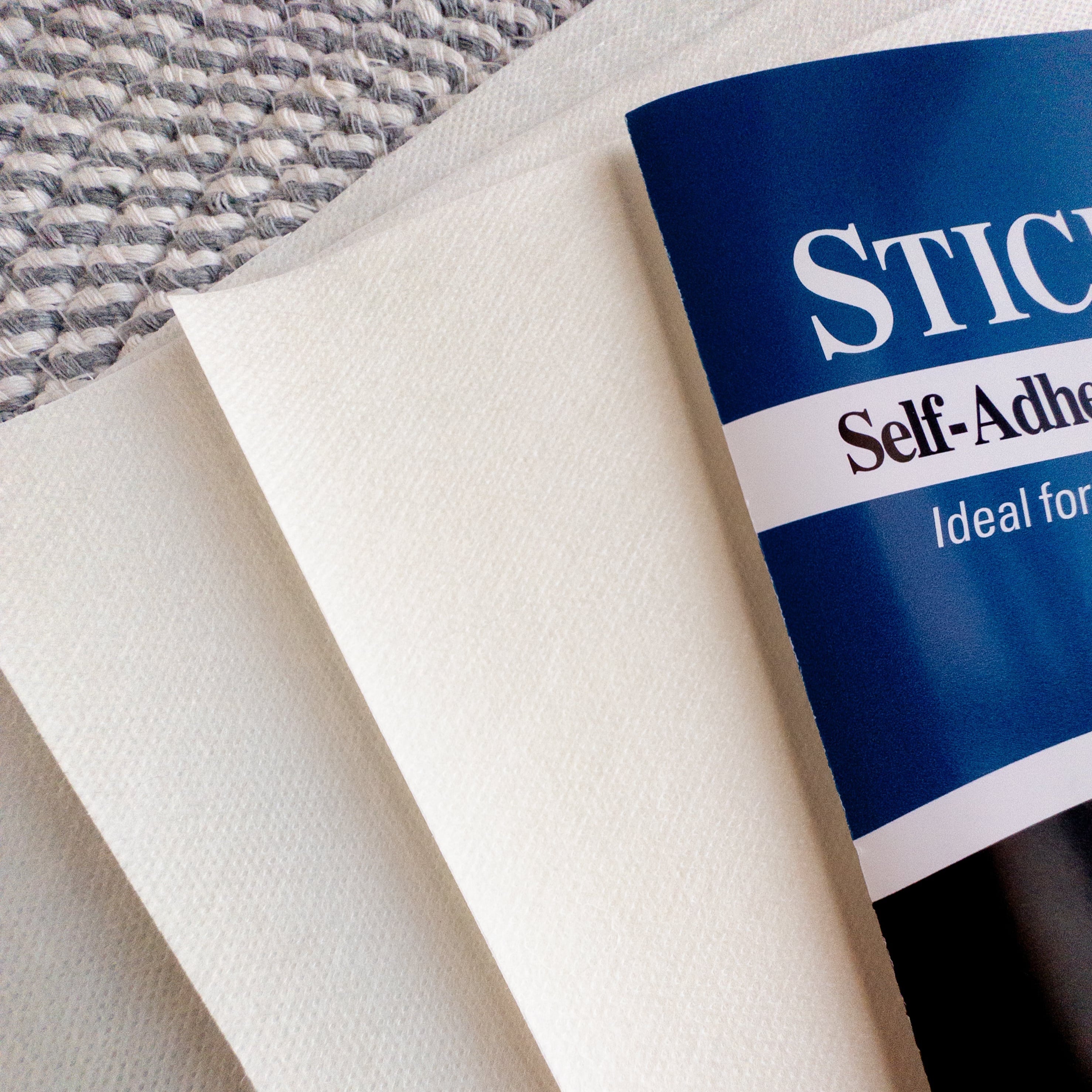 White Sulky Printable Stick & Stitch embroidery transfer paper sheets, 8.5" x 11", with blue packaging.