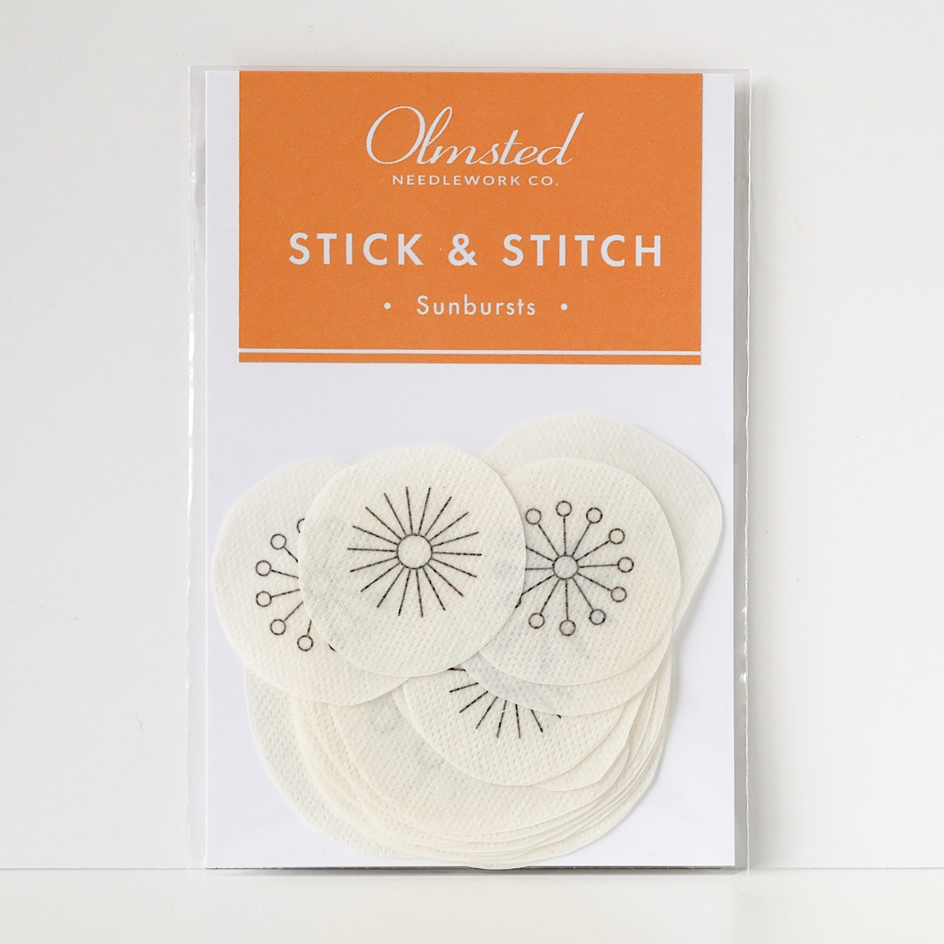 Olmsted Needlework Co. Sunburst Stick & Stitch patterns: 15 water-soluble embroidery patches with sun designs.