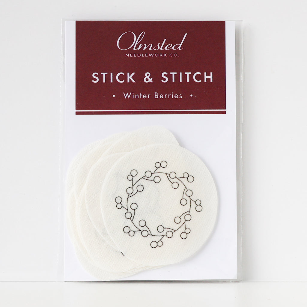 Olmsted Needlework Co. Winter Berry Stick & Stitch embroidery patterns on white water-soluble stabilizer.