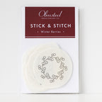 Olmsted Needlework Co. Winter Berry Stick & Stitch embroidery patterns on white water-soluble stabilizer.